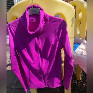 Under Armour all season magenta zip up. Size medium.
